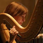 Woman playing harp
